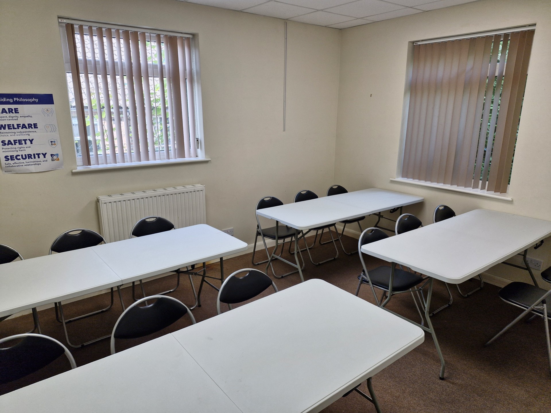 Meeting room at The Horizon Centre set up with tables and chairs for training or workshops