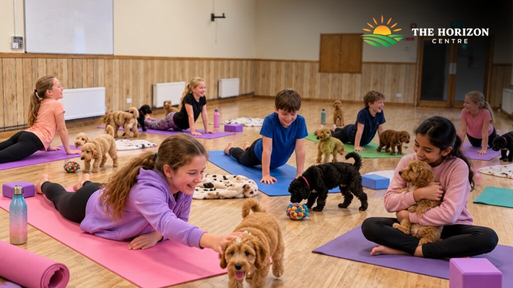 Children taking part in puppy yoga with gentle movement and puppy interaction at The Horizon Centre in Berkhamsted.